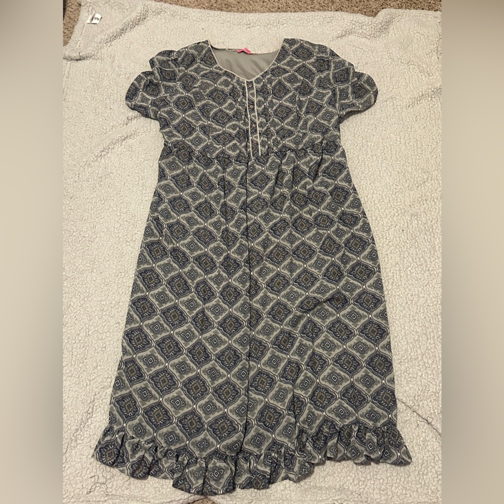 Woman Within Gray Patterned Dress